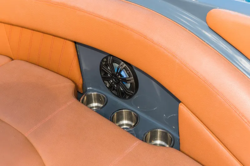 Slide: The Image of Luxurious seating with cup holders and speaker on 2017 Cruisers Sport Series 298 Bow Rider. - 15