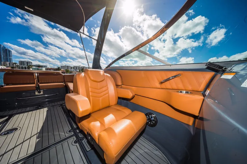 Slide: The Image of Luxurious interior of 2017 Cruisers Sport Series 298 Bow Rider South Beach Edition under sunny skies. - 22