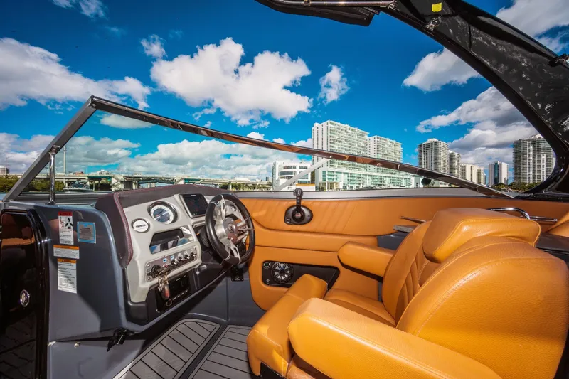 Slide: The Image of 2017 Cruisers Sport Series 298 Bow Rider South Beach Edition interior with city skyline. - 23