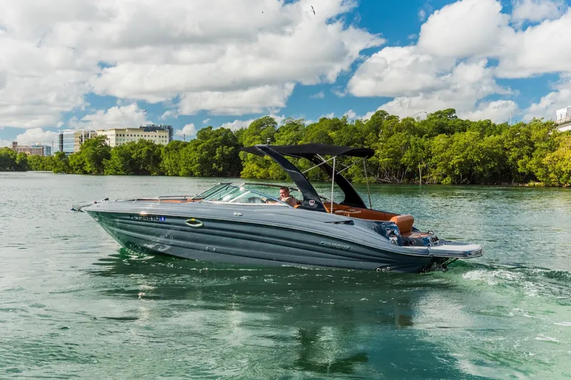 Slide: The Image of 2017 Cruisers Sport Series 298 Bow Rider South Beach Edition on scenic waterway. - 3