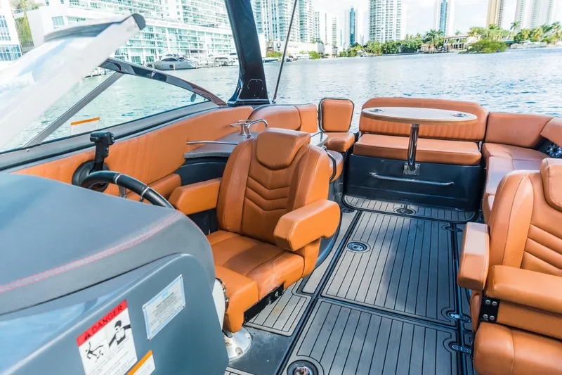 Slide: The Image of 2017 Cruisers Sport Series 298 Bow Rider South Beach Edition interior with luxurious seating. - 7