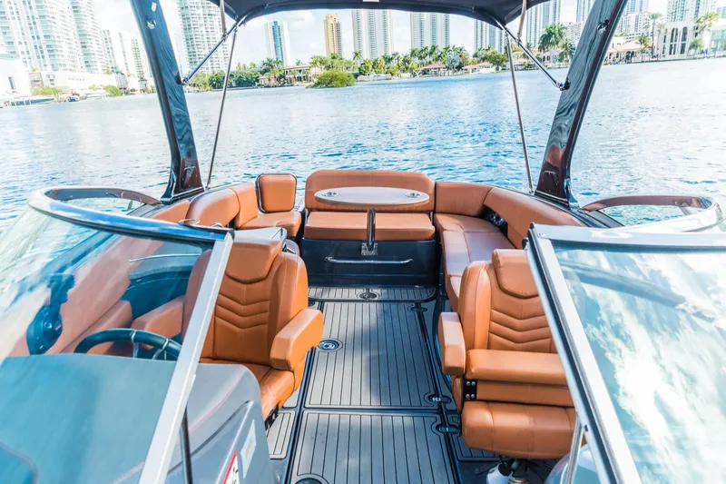 Slide: The Image of 2017 Cruisers Sport Series 298 Bow Rider South Beach Edition interior with luxurious seating. - 8