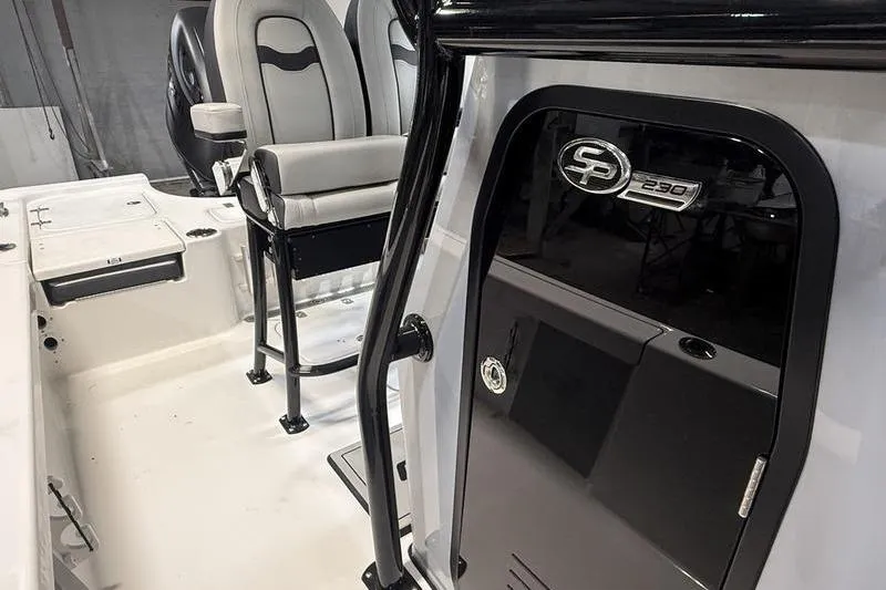 Slide: The Image of 2026 Sea Pro 230 Bay boat interior with seating and console details. - 11