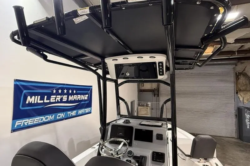 Slide: The Image of 2026 Sea Pro 230 Bay boat interior at Miller's Marine showroom. - 15