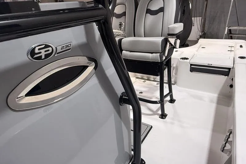 Slide: The Image of 2026 Sea Pro 230 Bay boat interior with seating and console details. - 19