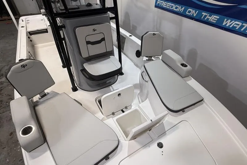 Slide: The Image of 2026 Sea Pro 230 Bay boat interior with seating and storage compartments. - 20