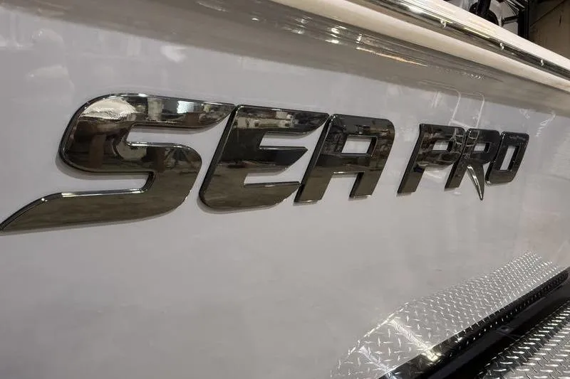 Slide: The Image of Close-up of 2026 Sea Pro 230 Bay boat logo on white hull. - 4