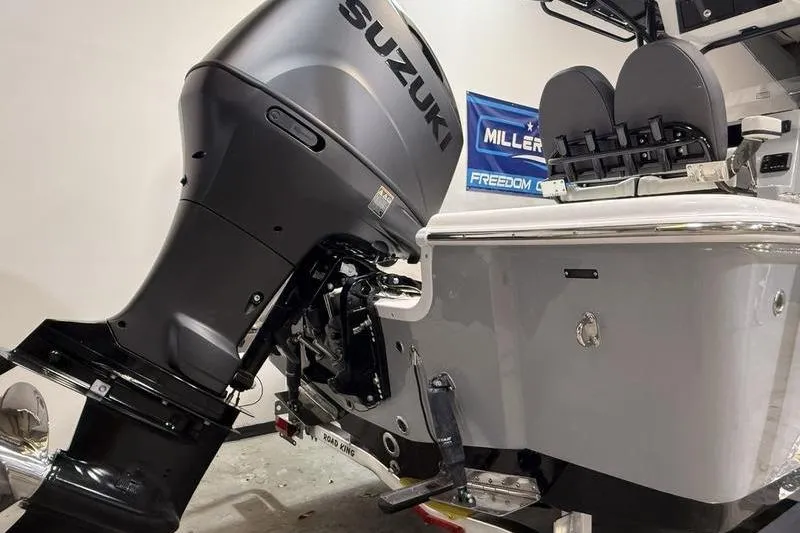 Slide: The Image of 2026 Sea Pro 230 Bay boat with Suzuki outboard motor in showroom. - 5