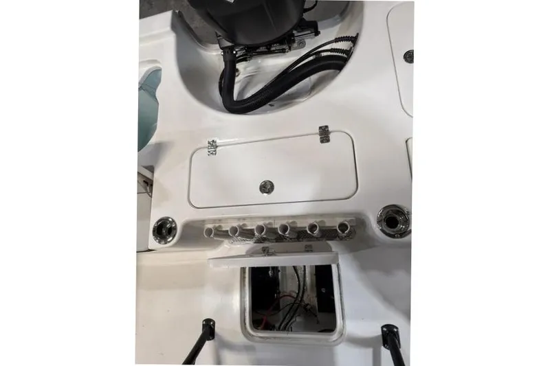 Slide: The Image of 2026 Sea Pro 230 Bay boat interior showing storage compartments and wiring. - 6