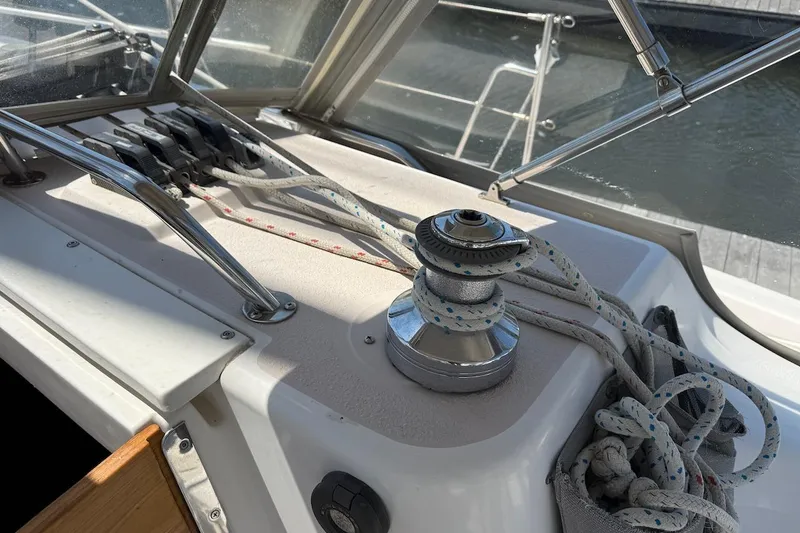 Slide: The Image of Close-up of a 1998 Catalina 380 sailboat winch and ropes on deck. - 15