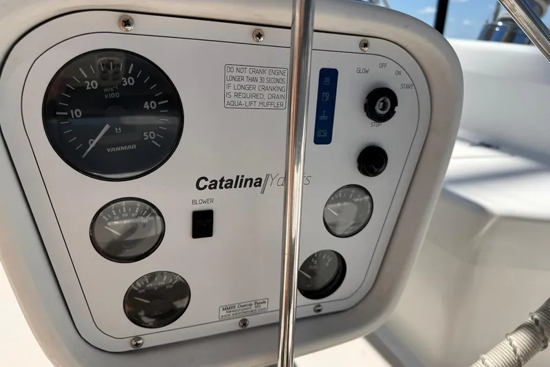 Slide: The Image of Control panel of a 1998 Catalina 380 yacht with Yanmar gauges and switches. - 19