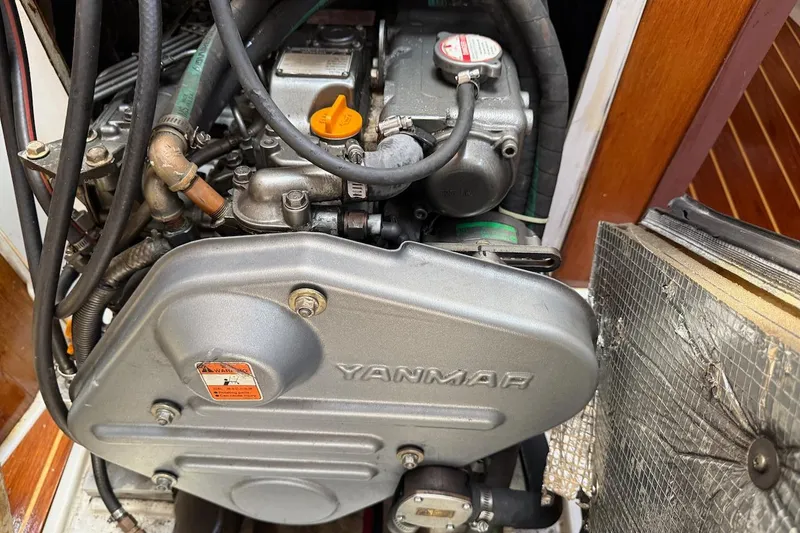 Slide: The Image of Yanmar engine in a 1998 Catalina 380 sailboat, showcasing detailed mechanical components. - 42