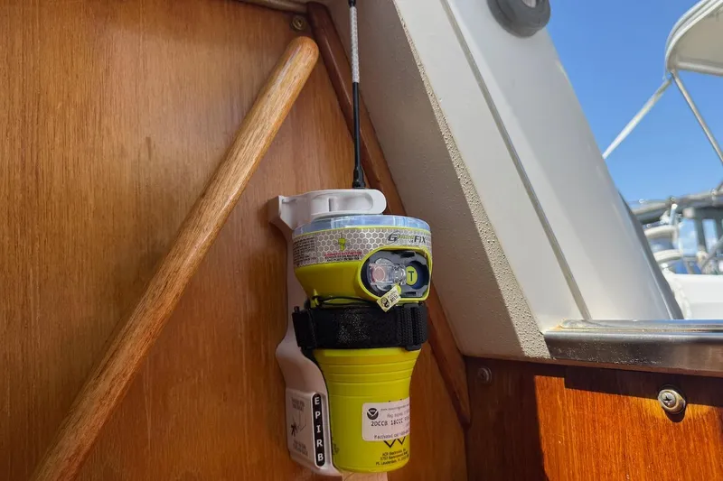 Slide: The Image of EPIRB device mounted on a 1998 Catalina 380 sailboat interior. - 46