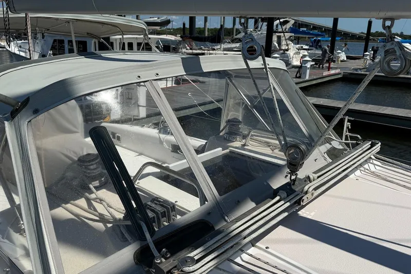 Slide: The Image of Cockpit view of a 1998 Catalina 380 sailboat docked at a marina. - 5
