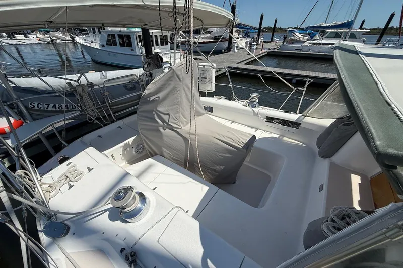 Slide: The Image of Cockpit of a 1998 Catalina 380 sailboat docked at a marina. - 6