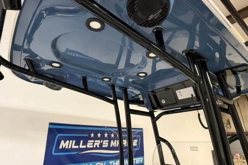 Slide: The Image of 2026 Sea Pro 230 Bay boat's T-top with integrated lights and speakers. - 15