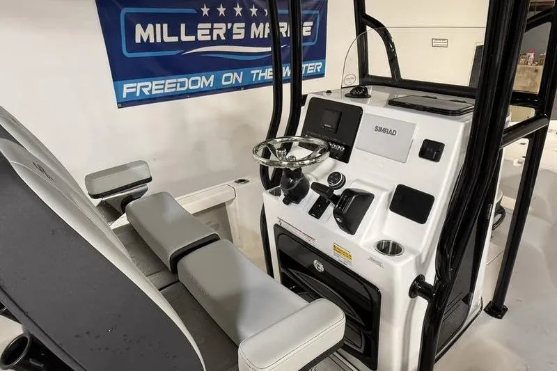 Slide: The Image of Interior view of 2026 Sea Pro 230 Bay boat with modern controls and seating. - 16