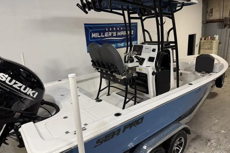 Slide: The Image of 2026 Sea Pro 230 Bay boat with Suzuki engine in showroom. - 3