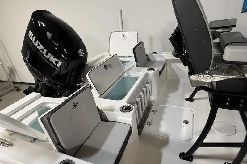 Slide: The Image of 2026 Sea Pro 230 Bay boat interior with Suzuki engine, featuring storage compartments and seating. - 8