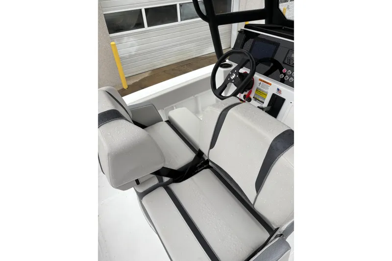 Slide: The Image of 2024 Scarab 235 ID boat interior with sleek seating and modern steering console. - 7