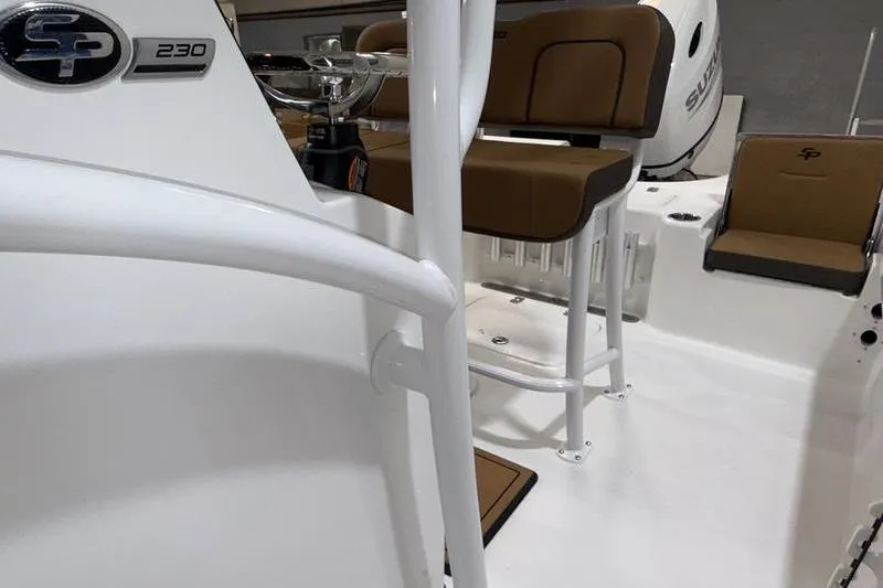 Slide: The Image of 2026 Sea Pro 230 Bay boat interior with seating and console details. - 15