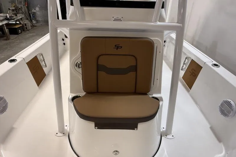 Slide: The Image of 2026 Sea Pro 230 Bay boat interior with tan seating and white framework. - 16