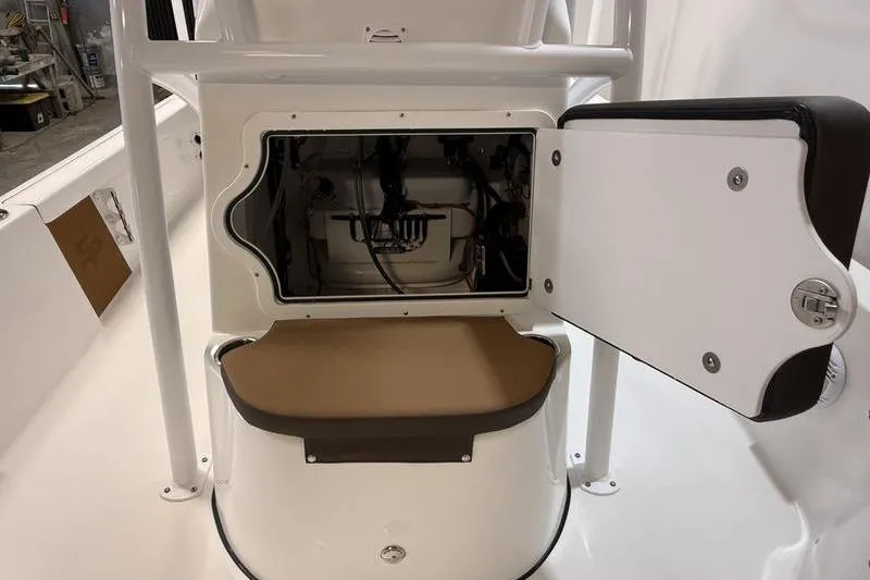 Slide: The Image of 2026 Sea Pro 230 Bay boat console with open storage compartment. - 17