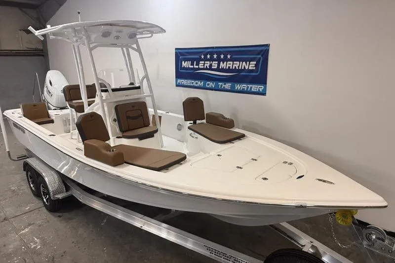 Slide: The Image of 2026 Sea Pro 230 Bay boat on trailer at Miller's Marine showroom. - 3