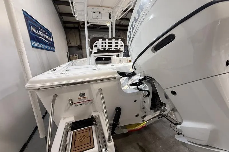 Slide: The Image of 2026 Sea Pro 230 Bay boat with Suzuki outboard motor in showroom. - 4