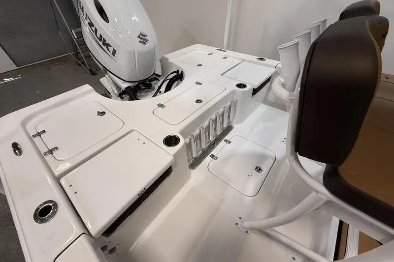 Slide: The Image of 2026 Sea Pro 230 Bay boat deck with Suzuki outboard motor and seating. - 5