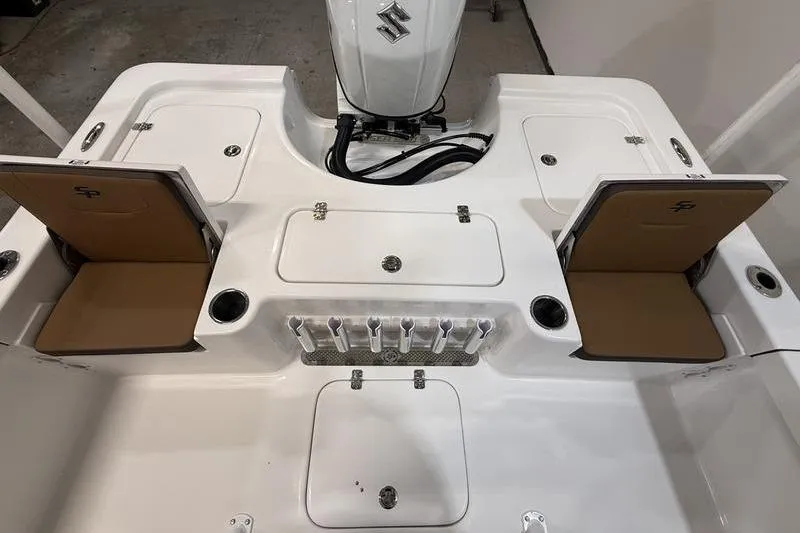 Slide: The Image of 2026 Sea Pro 230 Bay boat deck with storage compartments and Suzuki outboard motor. - 7