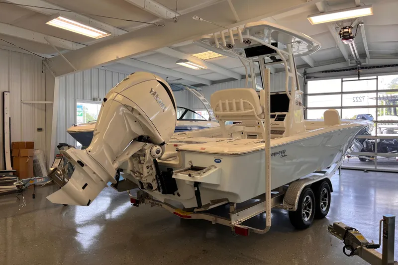 Slide: The Image of 2026 Tidewater 2500 Carolina Bay boat with Yamaha engine in showroom. - 2