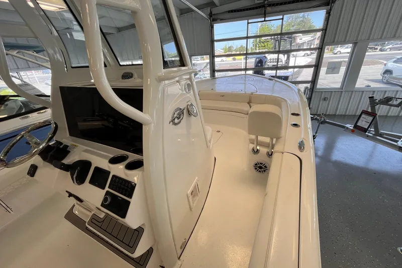 Slide: The Image of 2026 Tidewater 2500 Carolina Bay boat interior with steering console and seating. - 9