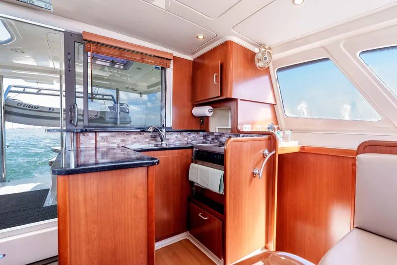 Slide: The Image of Luxurious 2011 Leopard 39 yacht interior with modern kitchen and ocean view. - 11