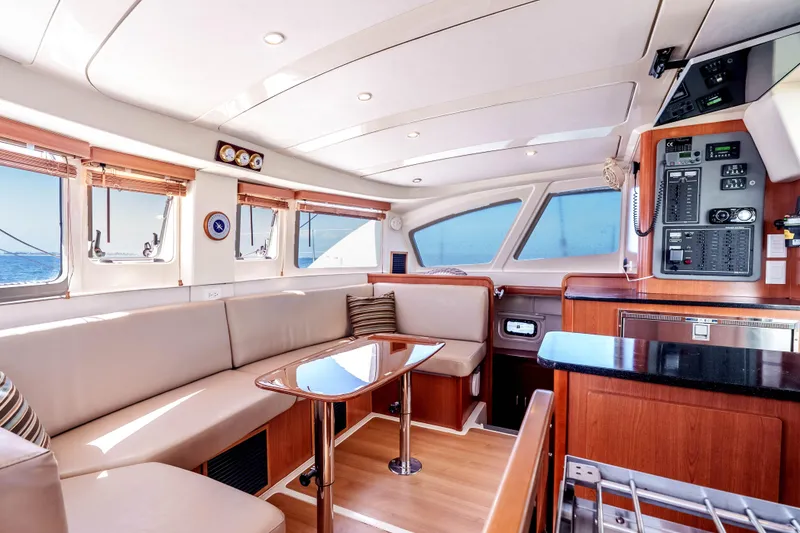 Slide: The Image of Luxurious interior of 2011 Leopard 39 yacht with modern seating and navigation panel. - 13
