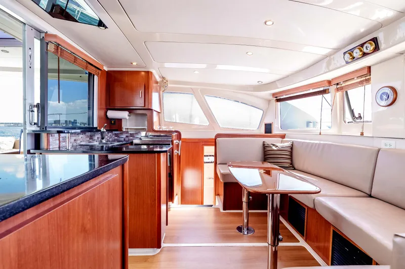 Slide: The Image of Luxurious interior of a 2011 Leopard 39 yacht with modern kitchen and seating area. - 14