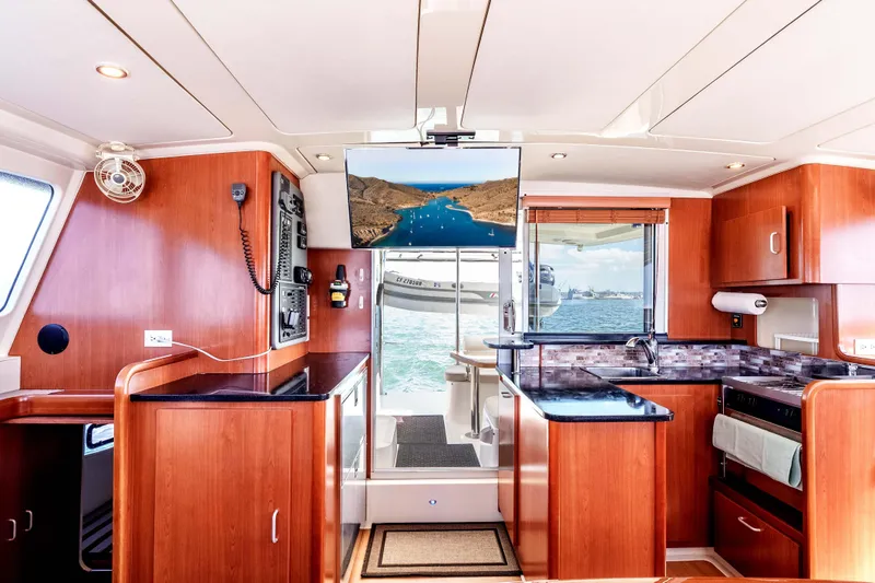 Slide: The Image of Luxurious Leopard 39 yacht interior with modern kitchen and ocean view, 2011 model. - 15