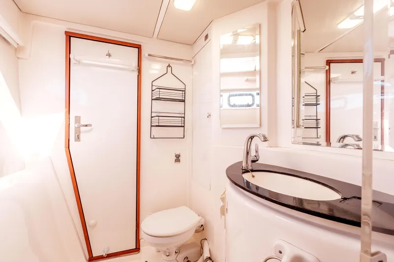 Slide: The Image of Bathroom interior of 2011 Leopard 39 yacht with modern fixtures and sleek design. - 20