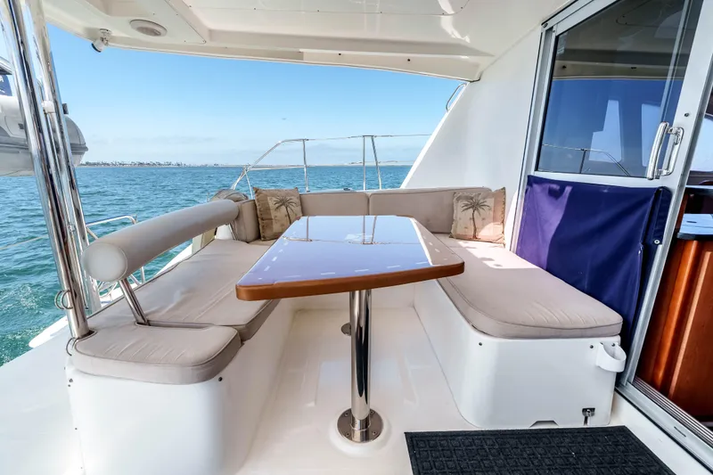 Slide: The Image of 2011 Leopard 39 yacht with outdoor seating, table, and ocean view. - 4