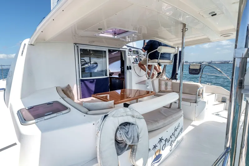 Slide: The Image of Leopard 39 yacht interior, 2011 model, featuring seating and helm on open deck. - 5