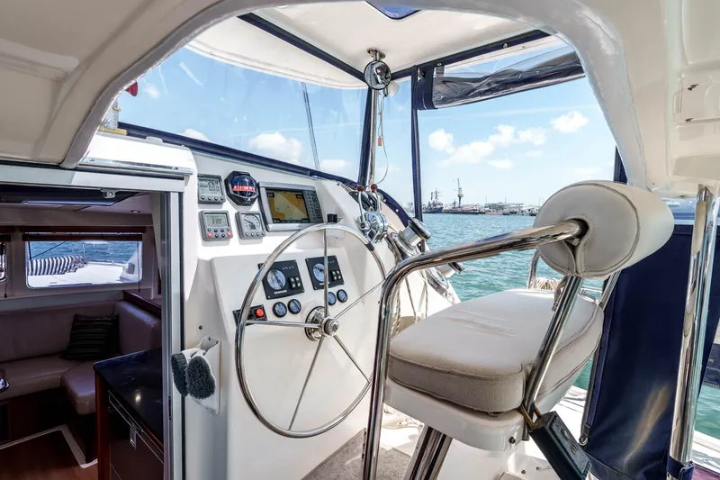 Slide: The Image of Interior view of a 2011 Leopard 39 yacht cockpit with steering wheel and navigation instruments. - 7