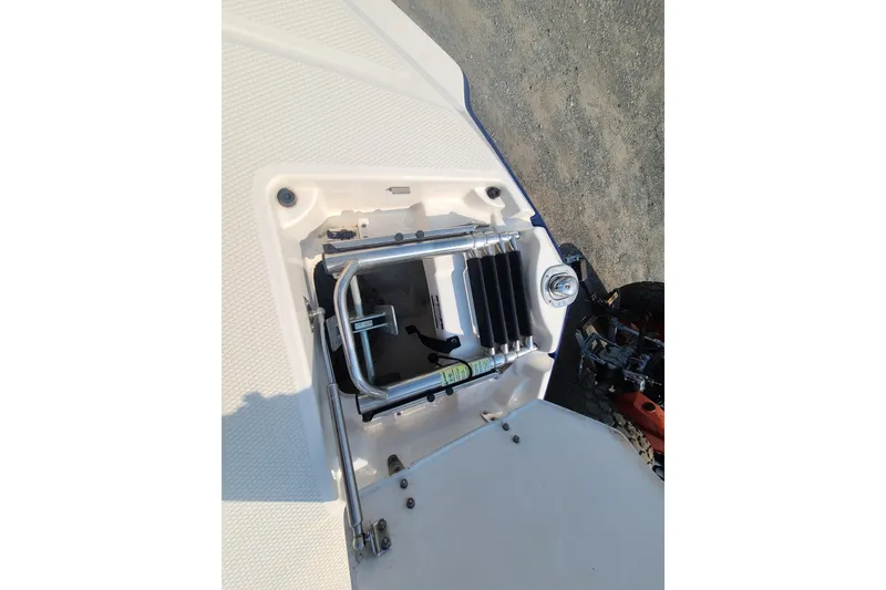 Slide: The Image of 2014 Chaparral 246 SSi boat ladder compartment with stainless steel ladder. - 13