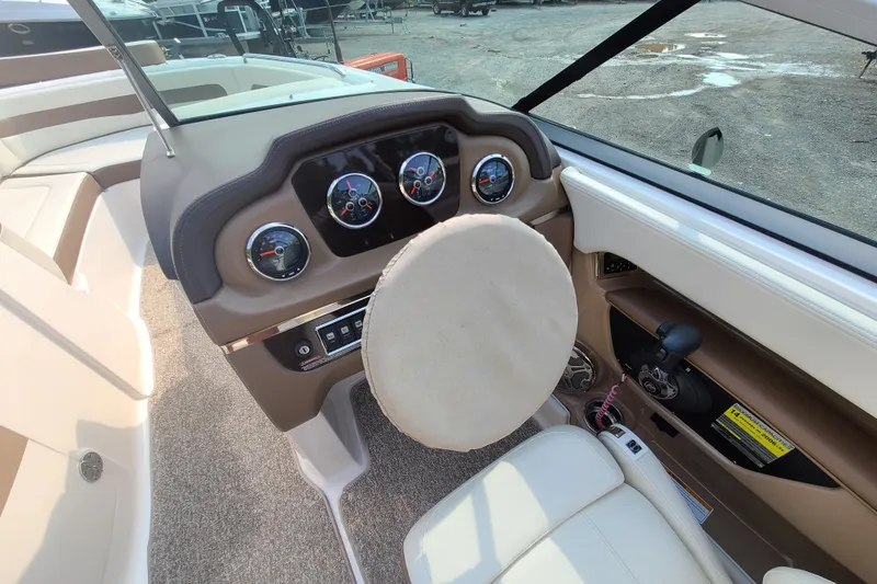 Slide: The Image of Interior view of 2014 Chaparral 246 SSi boat dashboard and steering wheel. - 18