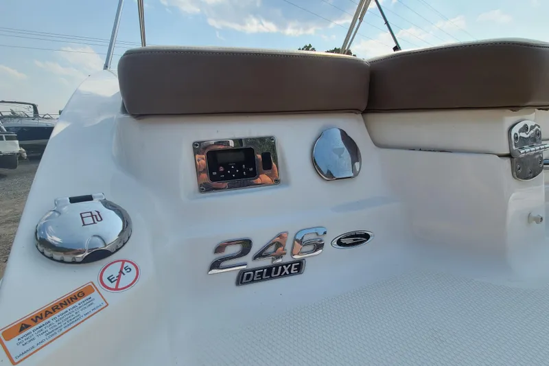 Slide: The Image of 2014 Chaparral 246 SSi boat interior with deluxe seating and control panel. - 20