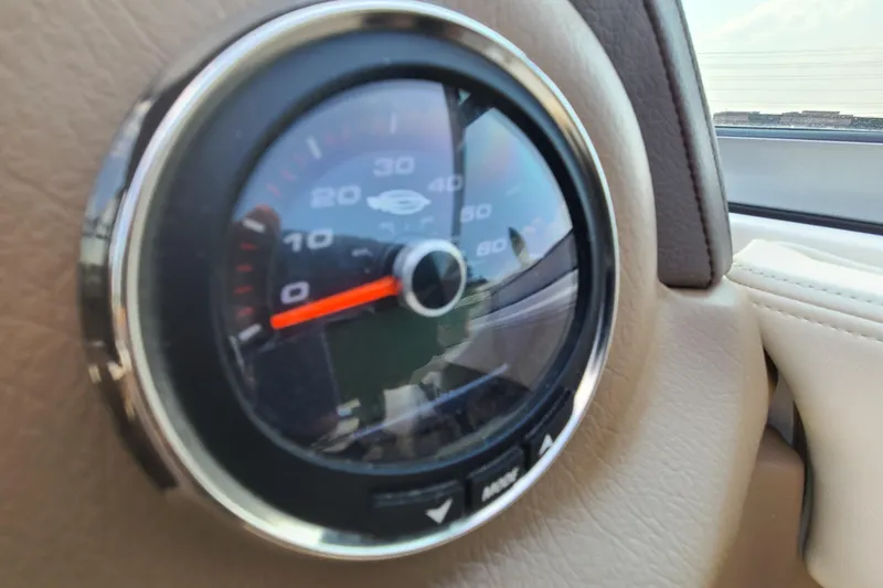 Slide: The Image of Close-up of a speedometer in a 2014 Chaparral 246 SSi boat. - 22