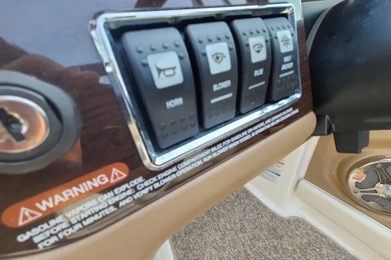Slide: The Image of Control panel of a 2014 Chaparral 246 SSi boat with warning label. - 24