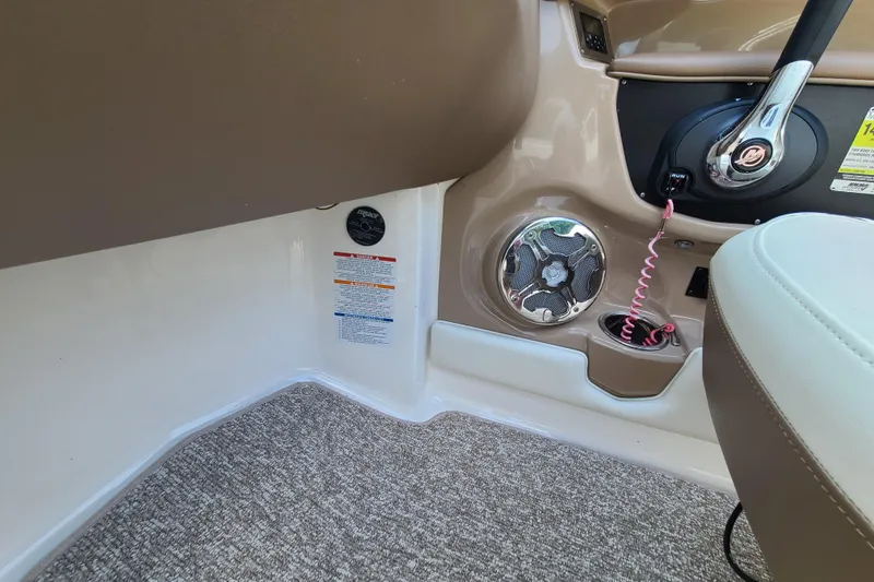 Slide: The Image of Interior of 2014 Chaparral 246 SSi boat showing control panel and speaker. - 25
