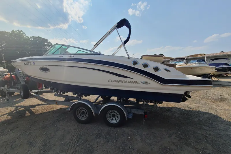 Slide: The Image of 2014 Chaparral 246 SSi boat on trailer under clear sky. - 3