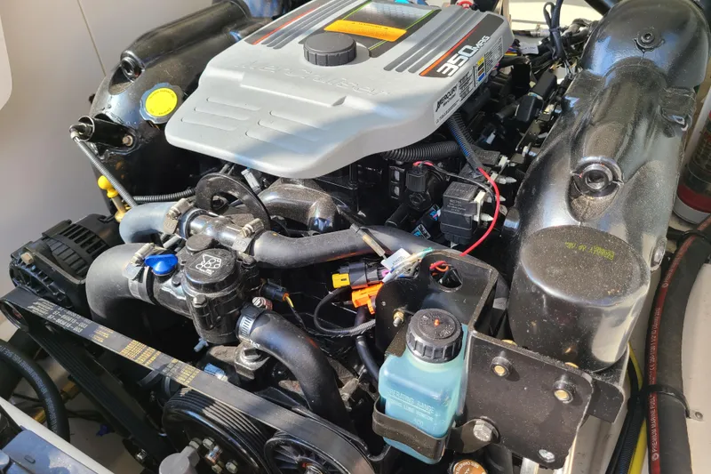 Slide: The Image of Engine of a 2014 Chaparral 246 SSi boat, featuring a Mercury 350 MAG motor. - 36