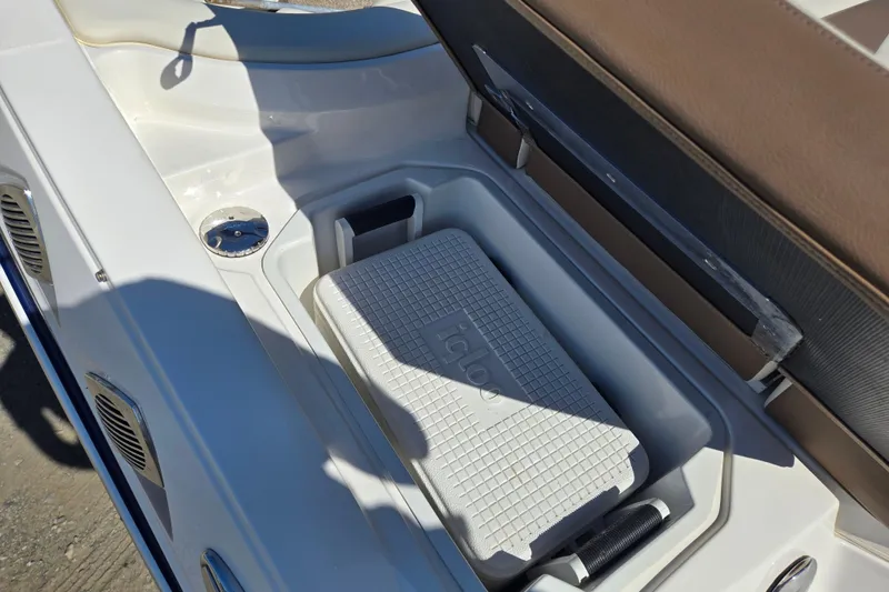 Slide: The Image of 2014 Chaparral 246 SSi boat with built-in cooler storage compartment. - 47